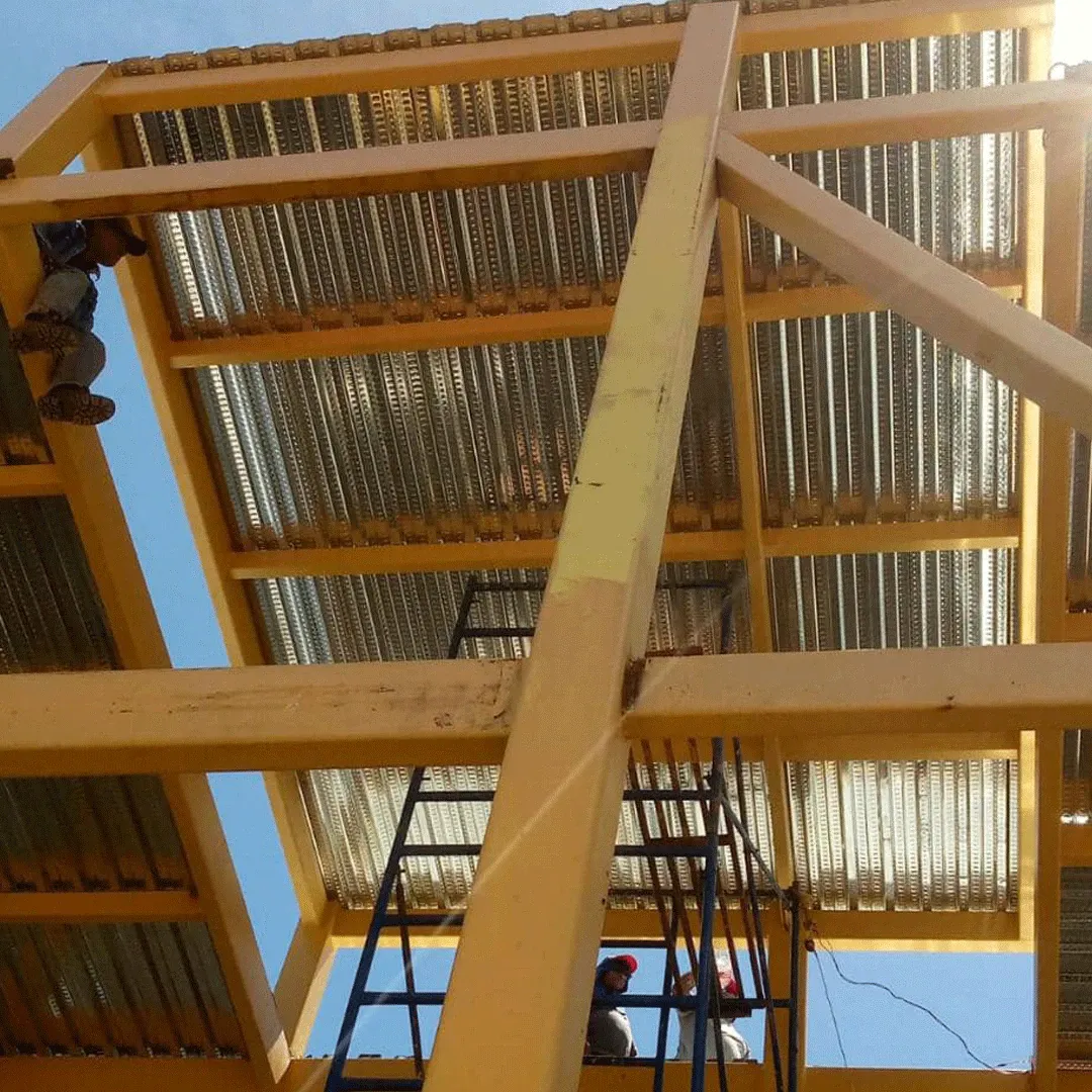 Underside view of roofing on a yellow steel structure