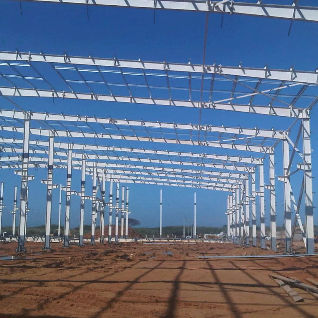 Industrial building frames aligned against a clear sky