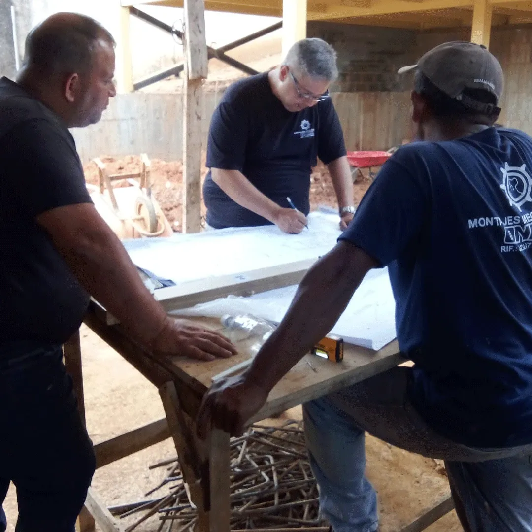 Drawings being reviewed on a table at the job site