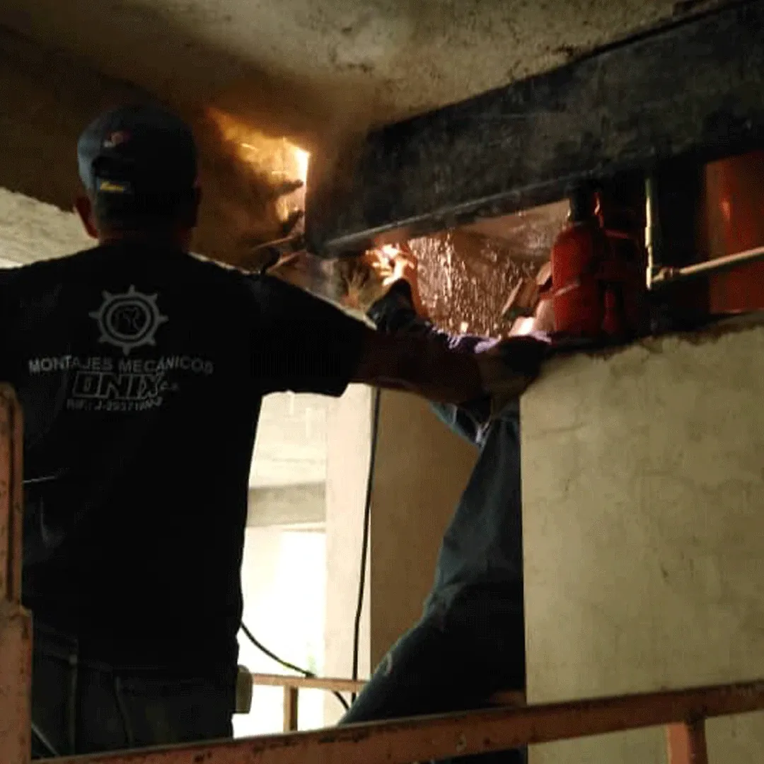 ONIX welder running a joint, sparks visible