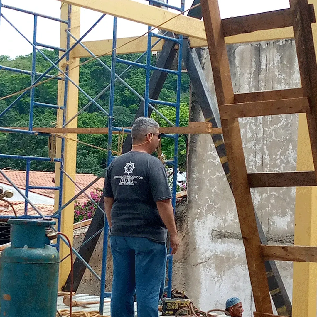 ONIX supervisor inspecting a job with scaffolding in place